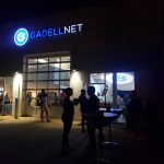 Employees having a company party at night at Gadellnet IT Solutions in St. Louis, MO