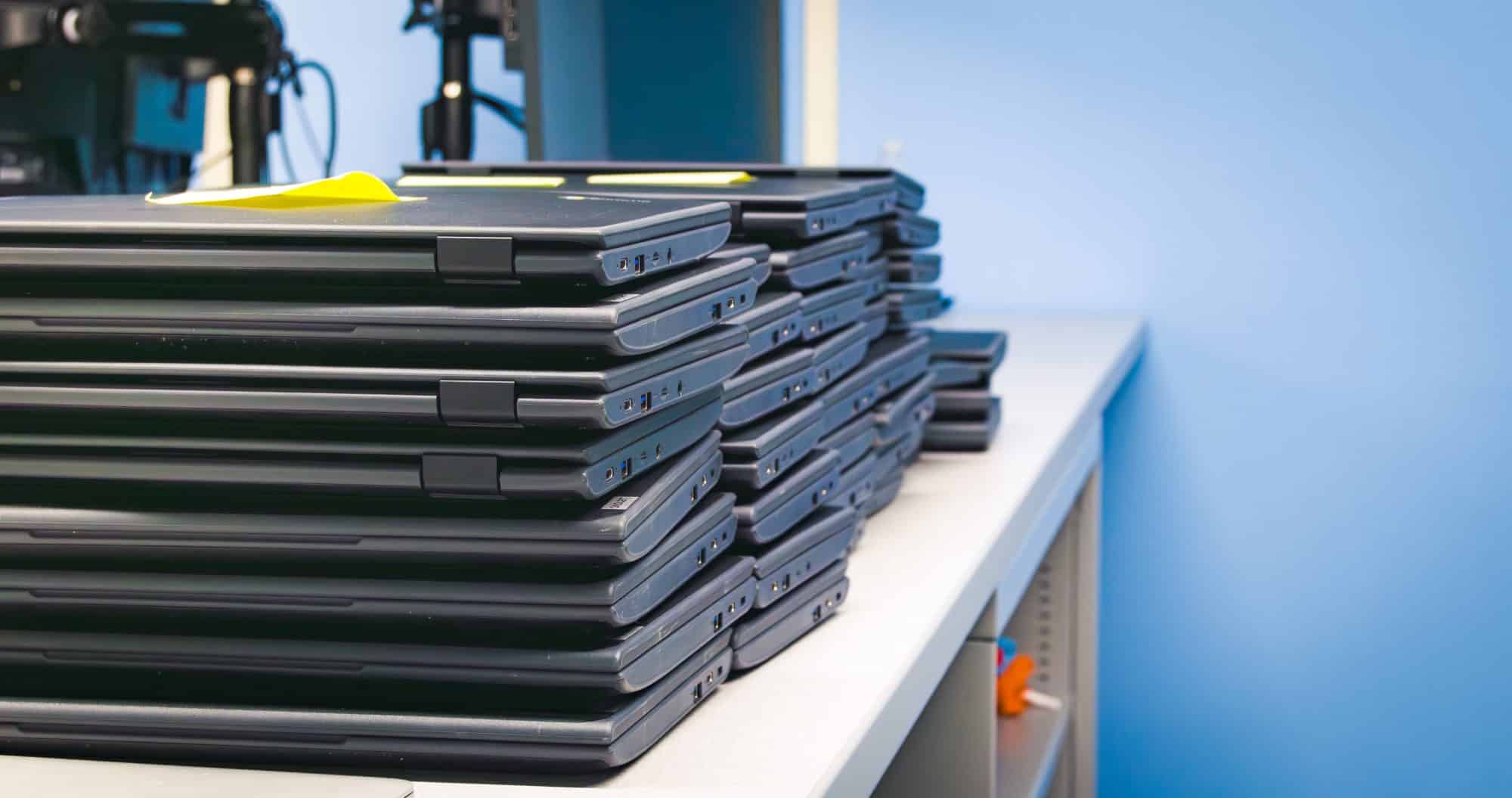 Stack of laptops ready to go to clients