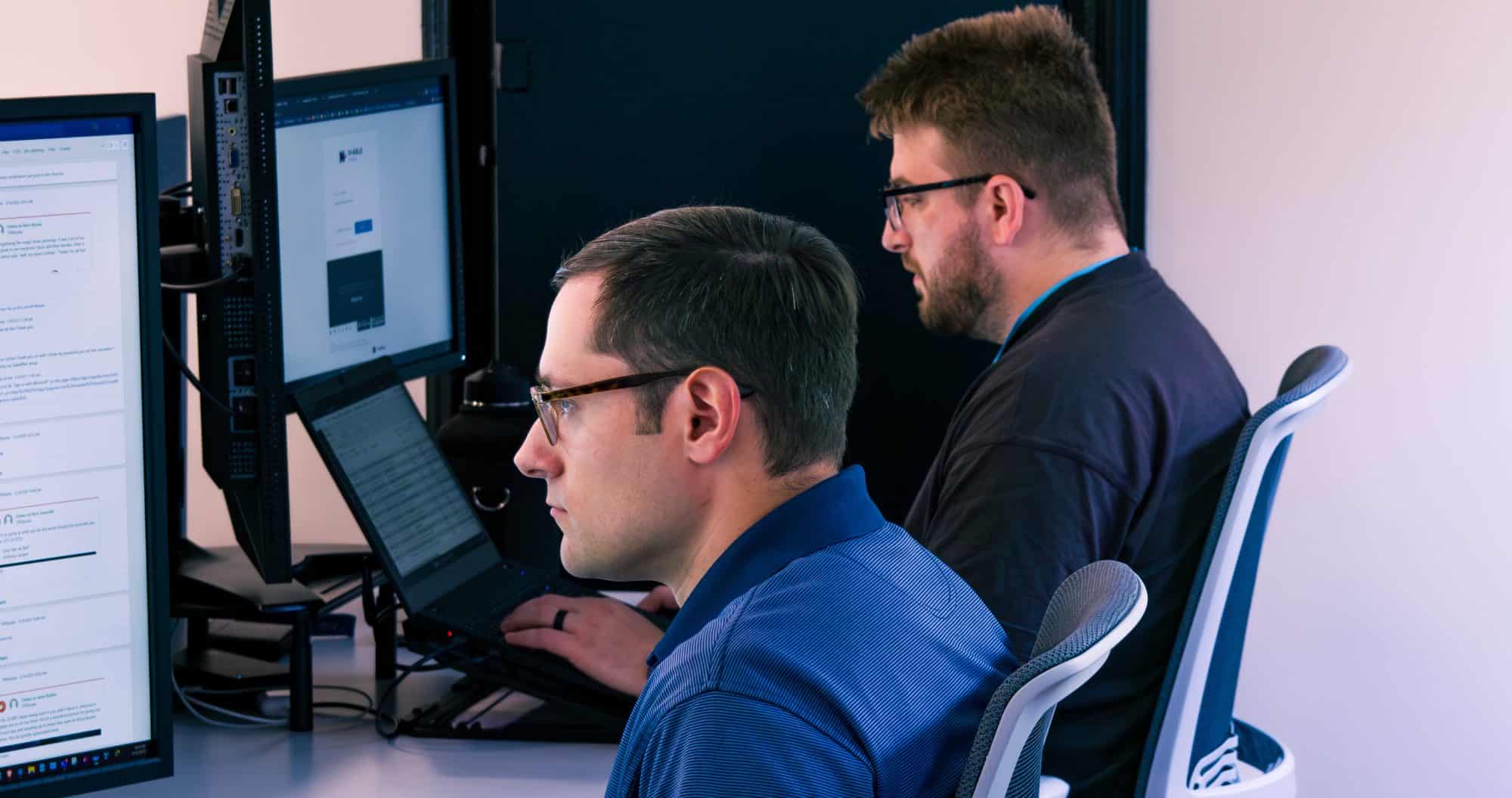 Cybersecurity engineers working on a tech problem