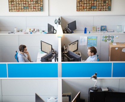 Employees working in cubicles in St. Louis office